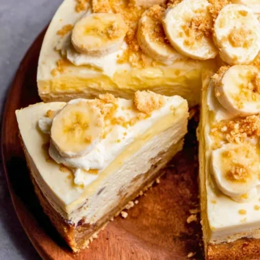 Delicious banana pudding cheesecake with whipped cream and banana slices on top