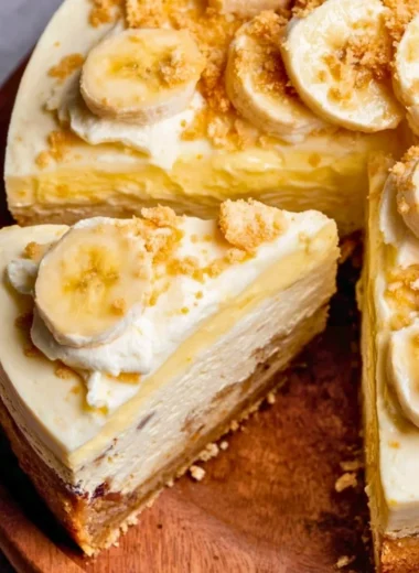 Delicious banana pudding cheesecake with whipped cream and banana slices on top