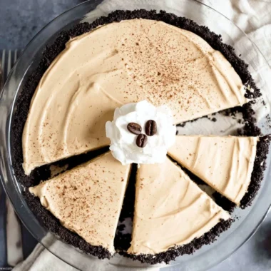 No-bake coffee pie topped with whipped cream and coffee beans
