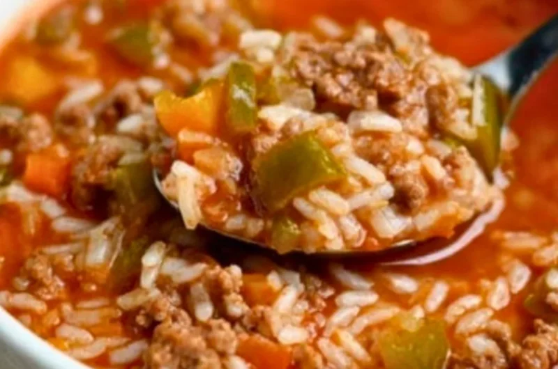 A bowl of flavorful stuffed pepper soup with colorful bell peppers and spices
