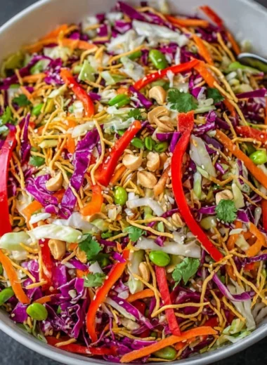 Bowl of colorful Asian Chopped Salad with fresh vegetables and dressing
