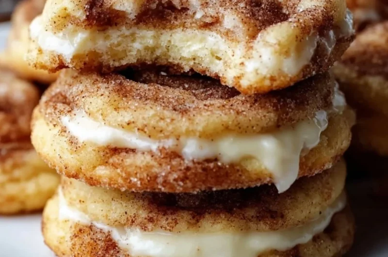 Delicious Cinnamon Roll Cheesecake Cookies stacked on a plate.