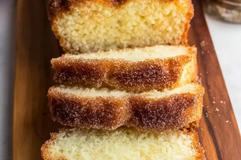 Sliced cinnamon sugar donut bread on a wooden table