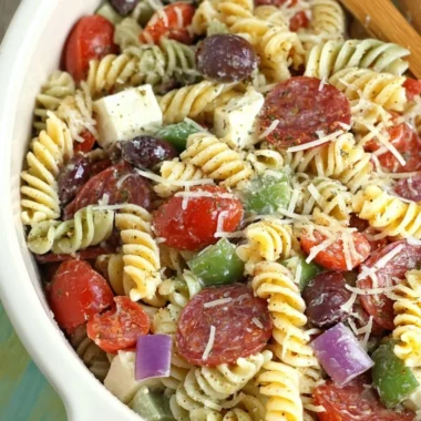 Classic Pasta Salad with fresh vegetables and dressing in a bowl