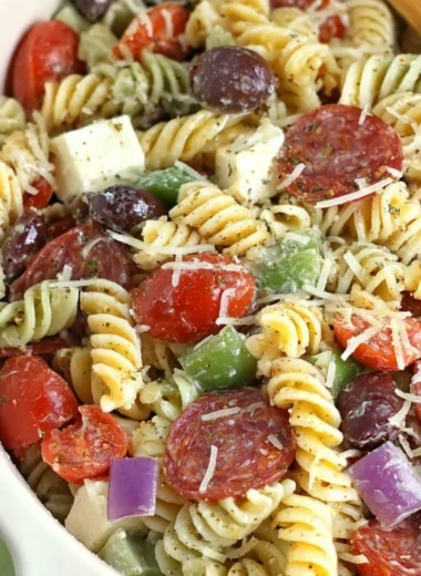 Classic Pasta Salad with fresh vegetables and dressing in a bowl