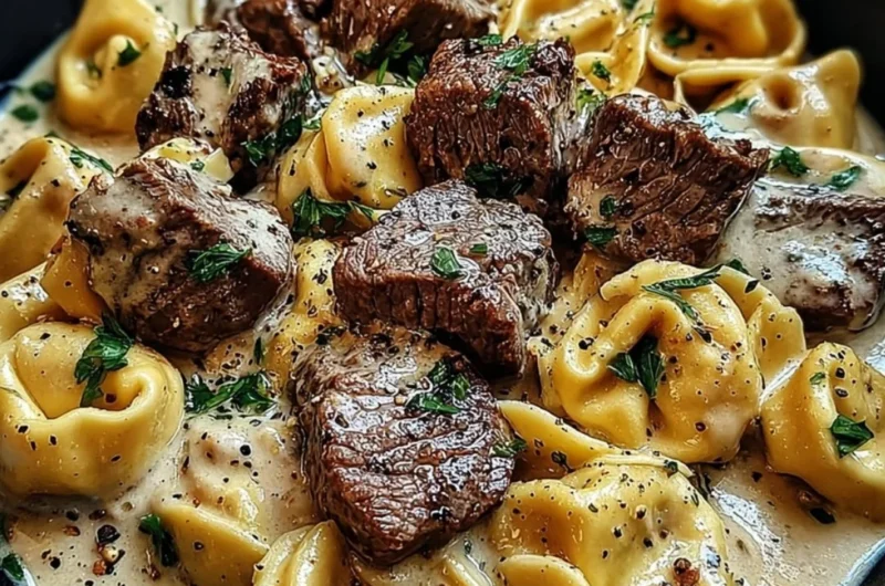 Cracked garlic steak tortellini served in creamy sauce with herbs
