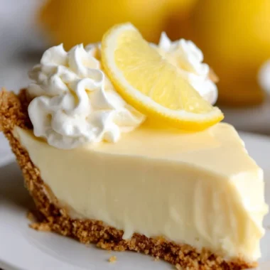 Delicious slice of lemon pie made with condensed milk, served as a refreshing dessert.