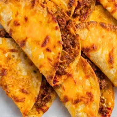 Delicious sheet pan tacos ready to be served, with fresh toppings and ingredients.