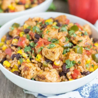 Delicious Southwest chicken and rice bowls with fresh vegetables and spices.