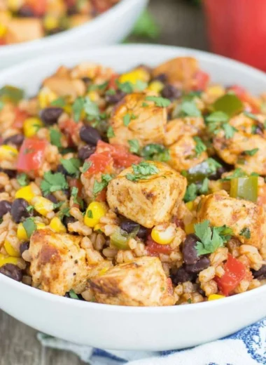 Delicious Southwest chicken and rice bowls with fresh vegetables and spices.