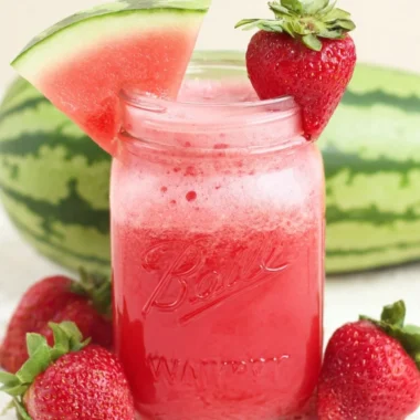 A refreshing glass of Strawberry Watermelon Cucumber Juice garnished with fresh mint.