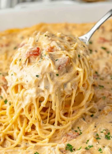 Delicious cheesy casserole topped with melted cheese and herbs