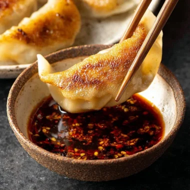 Homemade dumpling dipping sauce served in a small bowl.