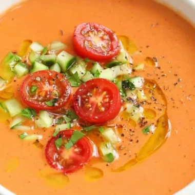 Bowl of easy gazpacho made with fresh vegetables and herbs