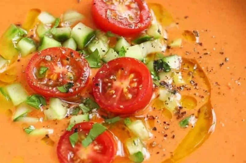 Bowl of easy gazpacho made with fresh vegetables and herbs
