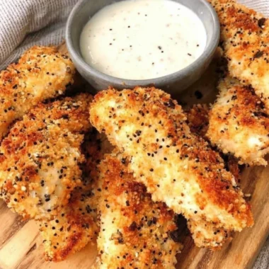 Crispy Everything Bagel Chicken Tenders with seasoning on a plate