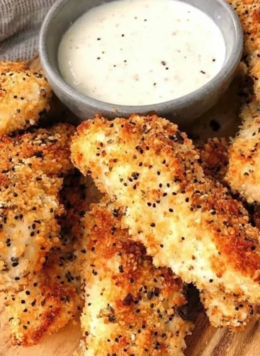 Crispy Everything Bagel Chicken Tenders with seasoning on a plate