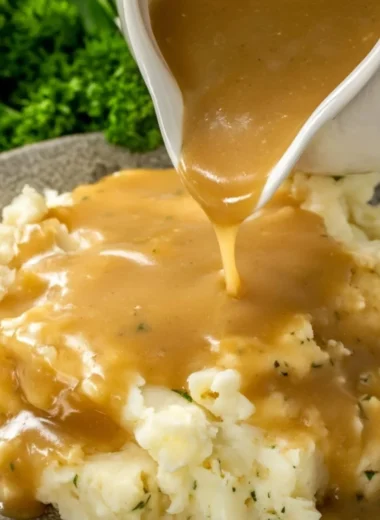 Rich and flavorful homemade gravy made from scratch in a saucepan.