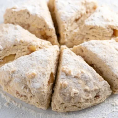 Freshly baked spiced apple scones with a golden crust and warm apple pieces
