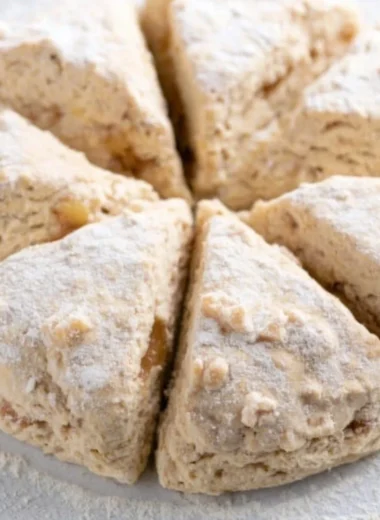 Freshly baked spiced apple scones with a golden crust and warm apple pieces