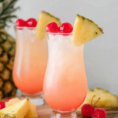 A refreshing Malibu Bay Breeze cocktail served in a glass with tropical garnishes.