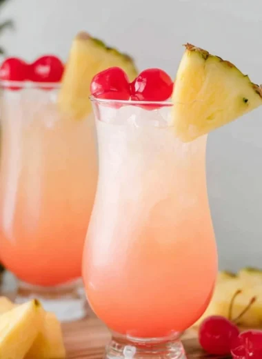 A refreshing Malibu Bay Breeze cocktail served in a glass with tropical garnishes.