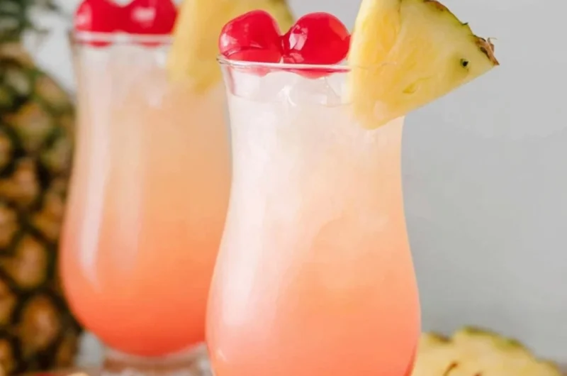 A refreshing Malibu Bay Breeze cocktail served in a glass with tropical garnishes.