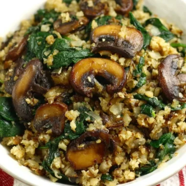 Mushroom and spinach sautéed with cauliflower rice for a healthy meal
