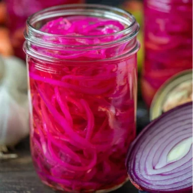 Quick pickled red onions in a jar, ready to enhance any meal.