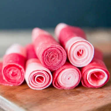 Homemade watermelon fruit leather snacks in colorful strips