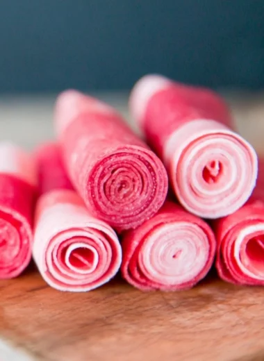 Homemade watermelon fruit leather snacks in colorful strips