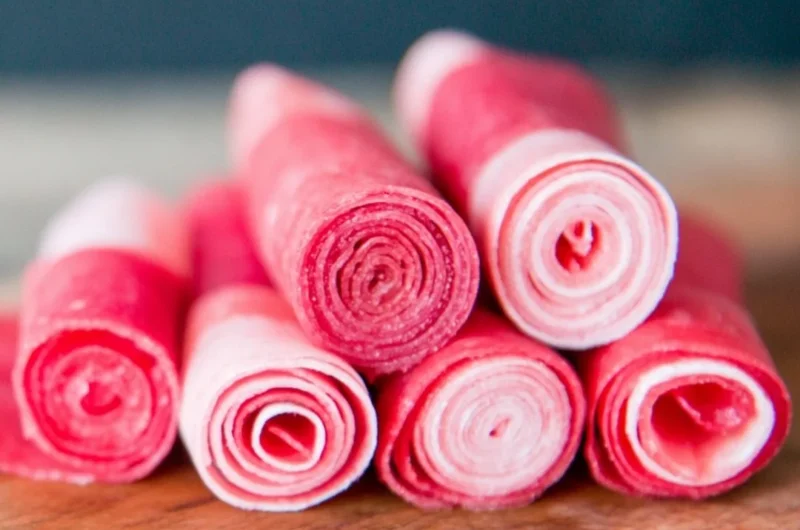 Homemade watermelon fruit leather snacks in colorful strips