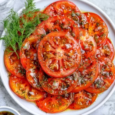 Fresh tomato salad with herbs and spices served in a cozy setting.