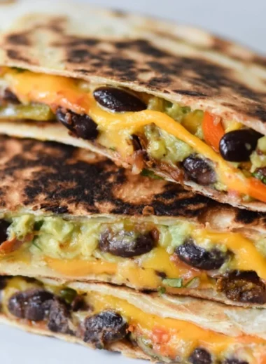 Cozy black bean veggie quesadilla with colorful vegetables and melted cheese
