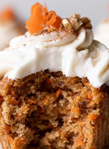 Cozy carrot cake cupcakes with cream cheese frosting on a wooden table