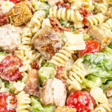 Cozy Chicken Caesar Pasta Salad served in a bowl with fresh ingredients