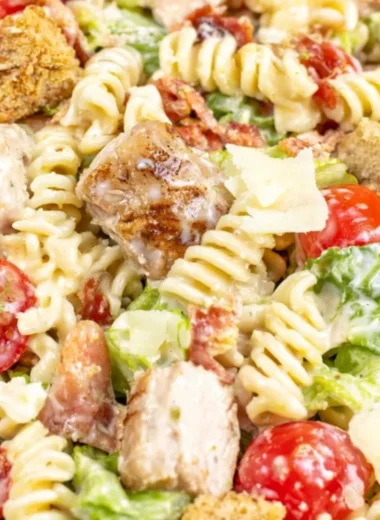Cozy Chicken Caesar Pasta Salad served in a bowl with fresh ingredients