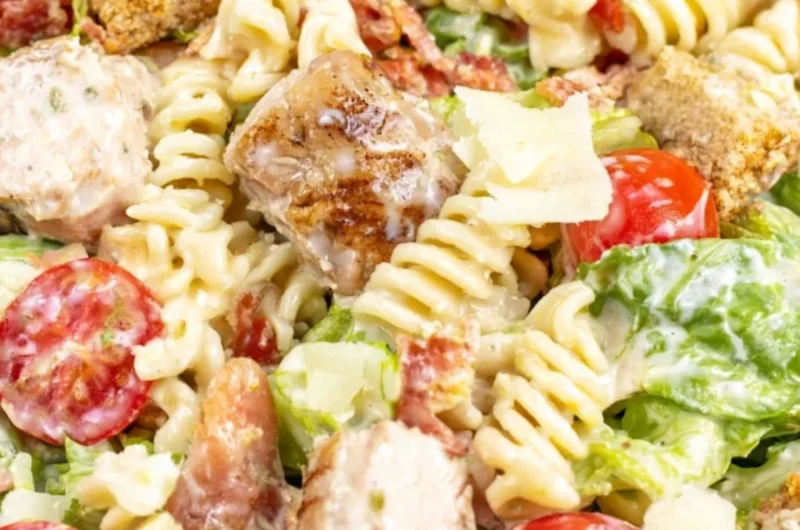 Cozy Chicken Caesar Pasta Salad served in a bowl with fresh ingredients