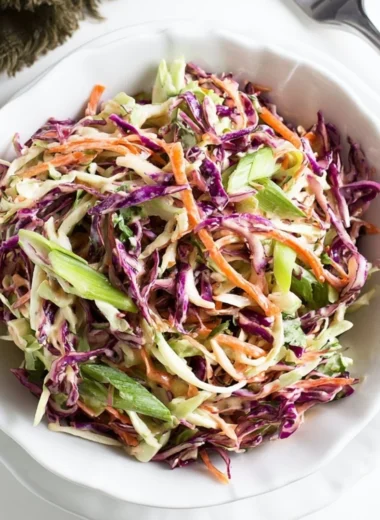 Cozy coleslaw served as a side for pulled pork sandwiches