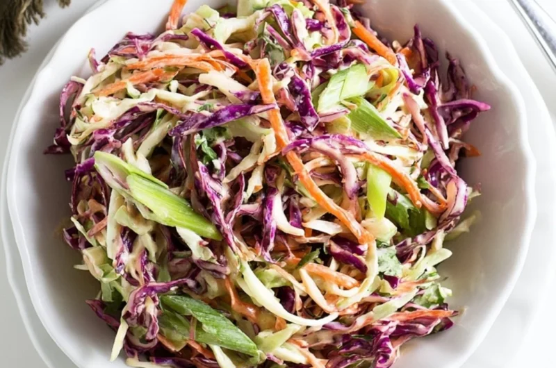 Cozy coleslaw served as a side for pulled pork sandwiches
