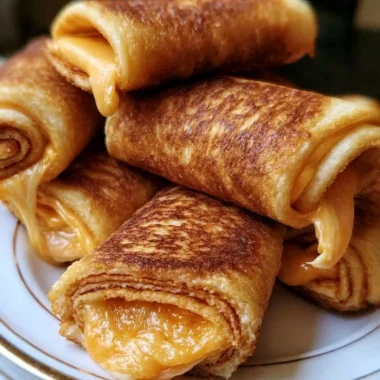 Crispy cheesy roll ups served on a plate, delicious and crunchy appetizer