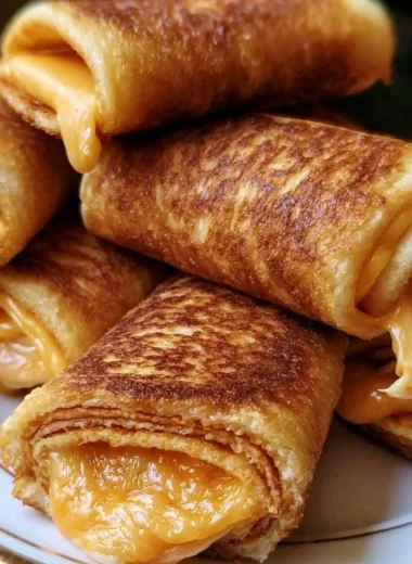 Crispy cheesy roll ups served on a plate, delicious and crunchy appetizer
