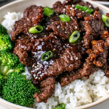 Delicious dish of easy Mongolian beef served with vegetables over a bed of rice