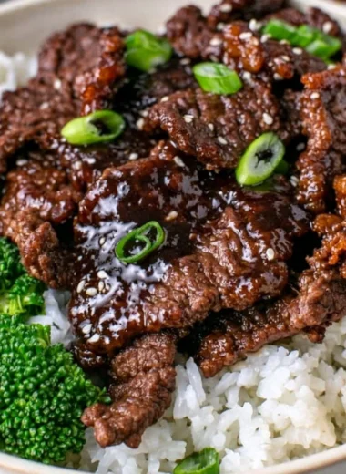Delicious dish of easy Mongolian beef served with vegetables over a bed of rice