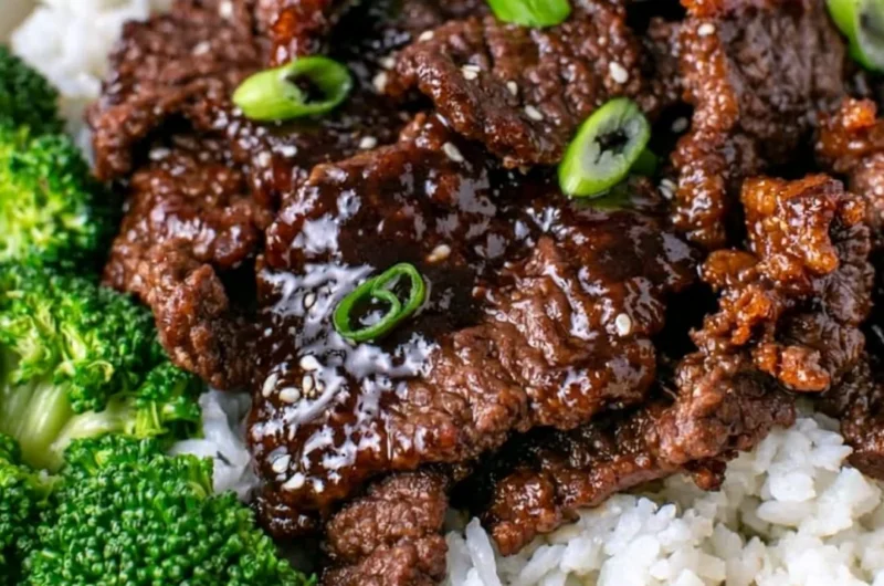 Delicious dish of easy Mongolian beef served with vegetables over a bed of rice
