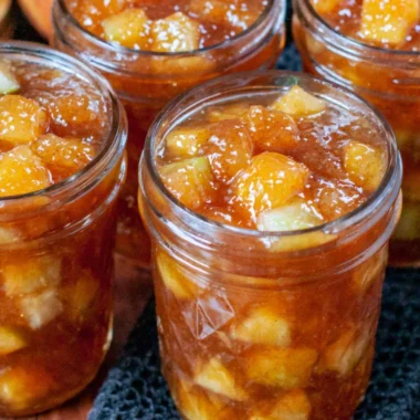 Homemade apple preserving jars and ingredients for fall recipes.