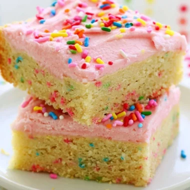 Delicious Funfetti sugar cookie bars topped with colorful sprinkles