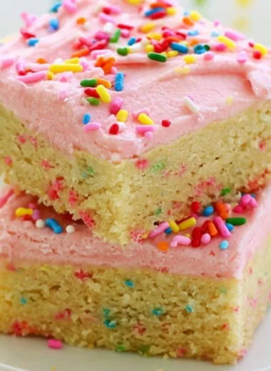 Delicious Funfetti sugar cookie bars topped with colorful sprinkles