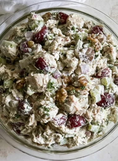 Healthy chicken salad without mayo served in a bowl with fresh vegetables.