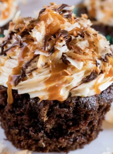 Delicious Samoas Cupcakes topped with caramel and toasted coconut.
